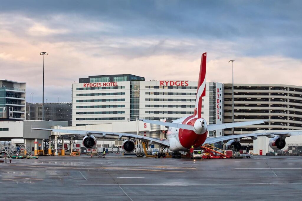 Exterior shot of Rydges Sydney Airport with planes